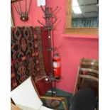 A 19th century cast iron combination stick and coat stand