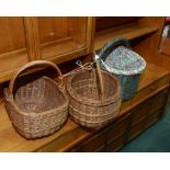 Three wicker handled baskets