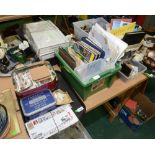 Three trays containing a quantity of loose stamps, postcards and first day covers