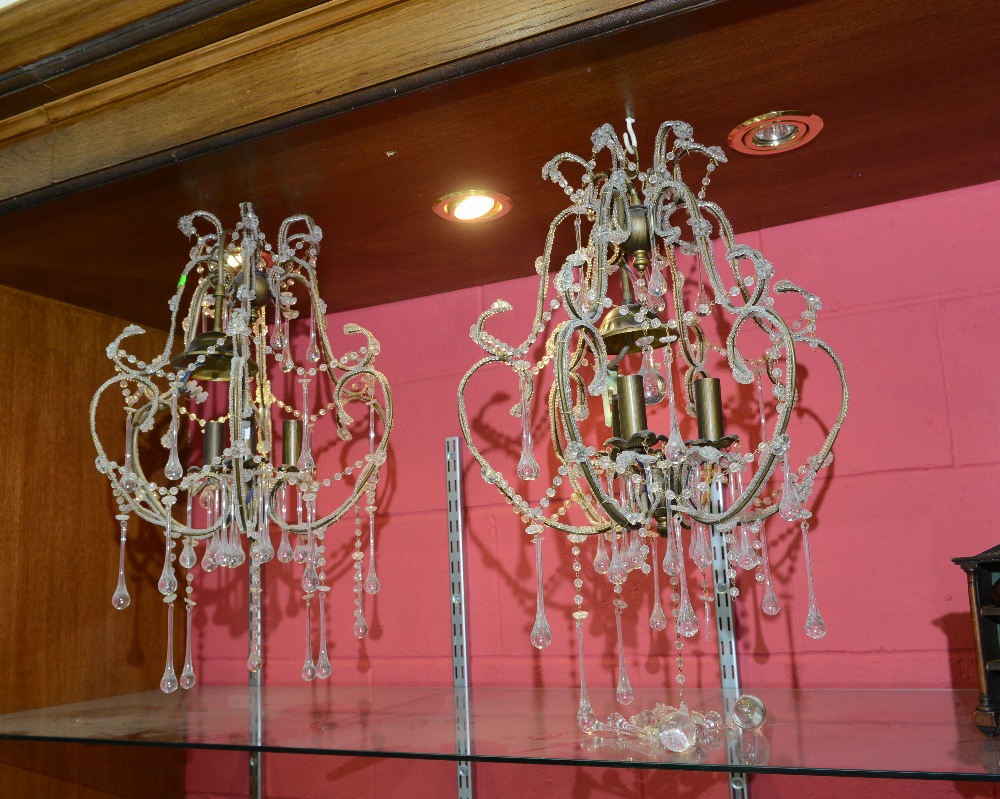 A pair of Venetian style three light chandeliers