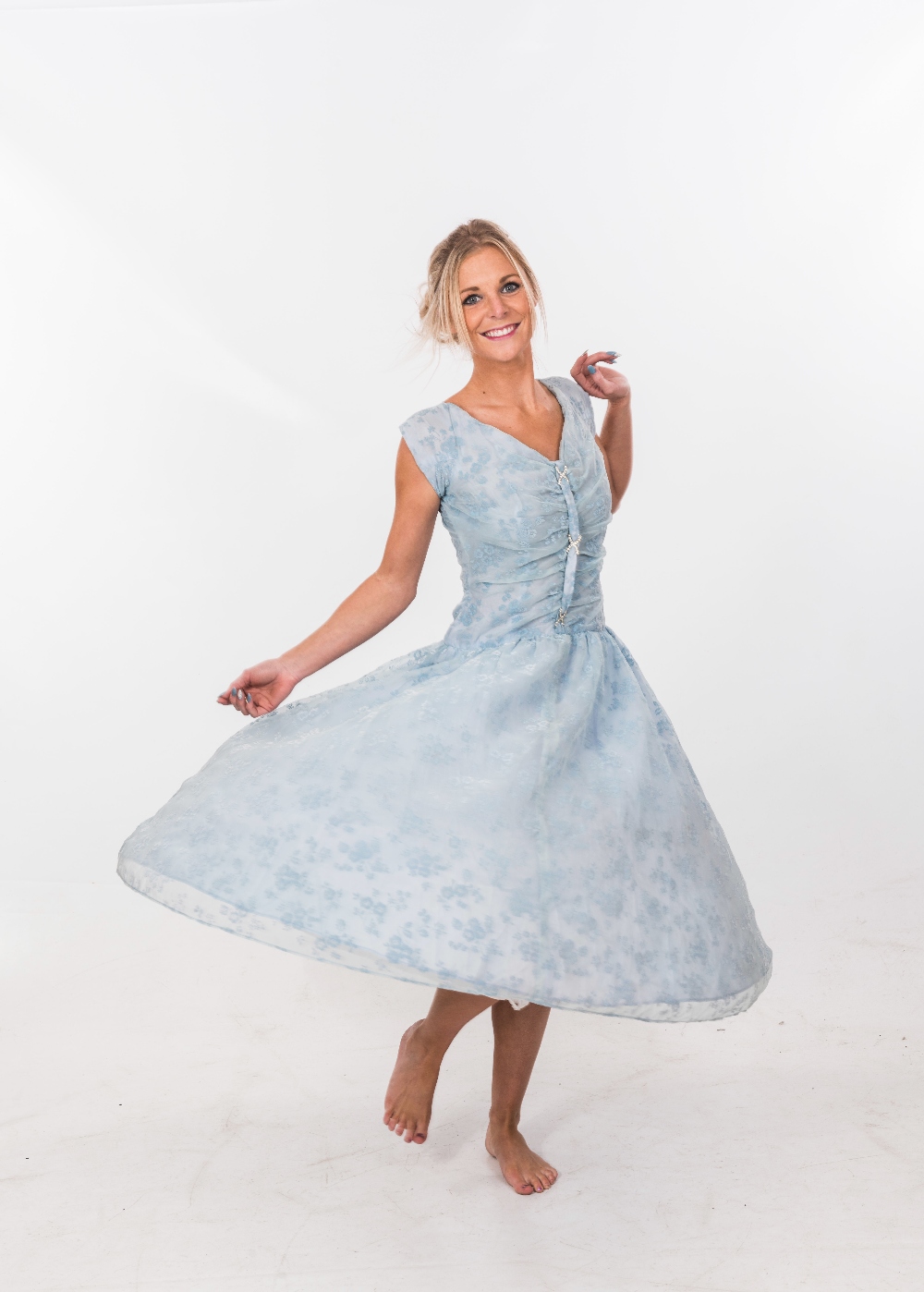A 1950's pale blue embroidered chiffon bridesmaid's dress with ruched bodice; together with an