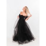 A 1950's black net strapless evening dress