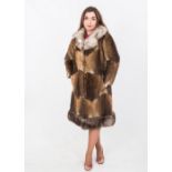 A 1970's chequered fur coat with contrasting collar and hem