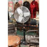 A large chrome Micromark pedestal fan, diameter 16 inches