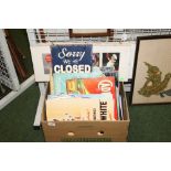 A box containing a quantity of new and as new vintage style advertising signs, enamel and canvas