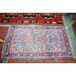 An antique Persian Sarough rug. 1.52m x 0.86m