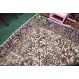 An antique Persian Heriz carpet. 2.79m x 1.90m