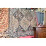 An antique Persian Quashqai rug. 2.45m x 1.55m