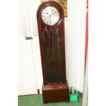 A dome topped grandmother clock