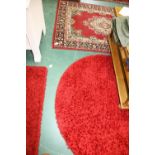 Two modern red rugs; tog, with an Indo Persian rug (3)