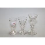 A drawn trumpet dram glass together with two 19th Century wine flutes with knopped stems (3)