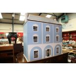 A large painted doll's house and doll's house furniture