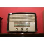 A vintage bakelite cased HMV radio