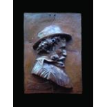 EMILE GRITTEL (1870 - 1953) Plaque en grès émaillé brun figurant le buste de profil de Jean