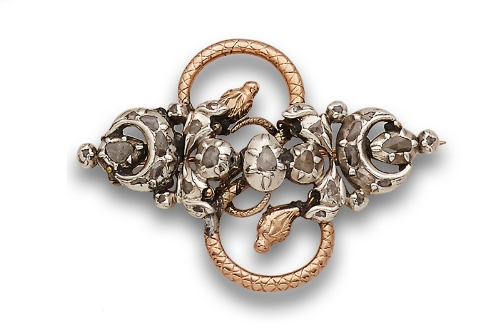 Broche s.XIX de diamantes con media lunas y flores, sobre pieza de serpiente de dos cabezas