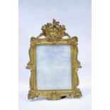 A 19th century rectangular wall mirror in gilt gesso rococo-style frame; 35" x 24".