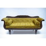 A William IV carved mahogany frame scroll-end sofa decorated with stylised leaf-scrolls, on short