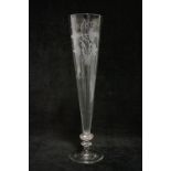 A late 18th/early 19th century tall ale flute, the slender tapered bowl engraved with hops & barley,