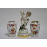 A late 19th century Meissen porcelain figure of Cupid caught in a man-trap, 7½" high (w.a.f.); & a