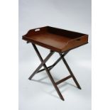 A 19th century mahogany butler’s tray with pierced carrying handles to the sides, 30" x 18½"; on