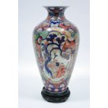 A 19th century JAPANESE IMARI VASE of ovoid form, profusely decorated with figure scenes, diaper