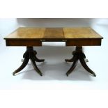 A George IV mahogany twin-pedestal dining table, the rectangular top with reeded edge &one