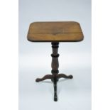 A Victorian mahogany tripod table with rectangular top, on slender turned centre column & three