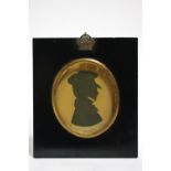 A mid-19th century head-&-shoulders silhouette portrait of a gentleman, dated 1844; & an early