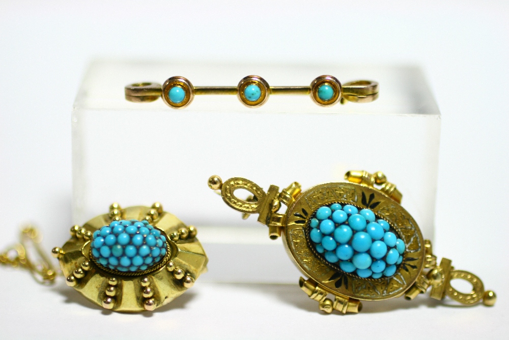 A Victorian gold oval brooch set cluster of turquoise beads, with safety chain; a similar oval