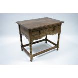 A 17th century style oak side table fitted frieze drawer, with shaped apron, & on bobbin-turned legs