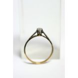 An antique ring set single old-cut diamond.