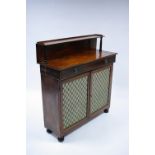 A regency mahogany chiffonier with open shelf to the raised back, fitted frieze drawer with brass