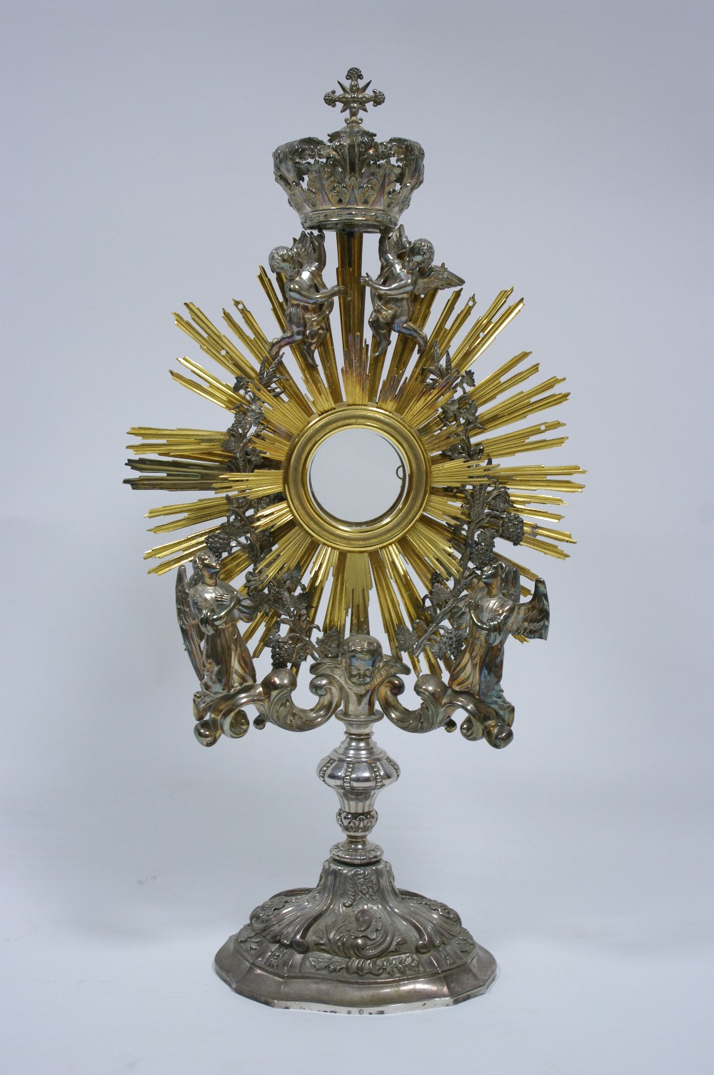 A MID-19th century BELGIAN SILVER & SILVER-GILT MONSTRANCE, the central circular glazed