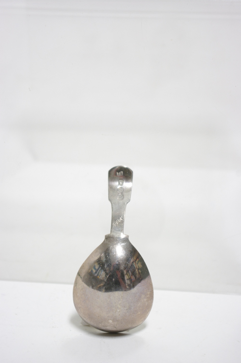 A George III Fiddle pattern caddy spoon, the wide oval bowl with pricked decoration of leaves & - Image 2 of 2