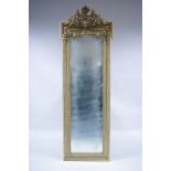 A 19th century narrow rectangular pier glass in painted gesso frame with putto surmount, floral