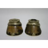 A pair of horse’s hooves, one mounted as an inkwell, the other as a spill-holder (w.a.f.).