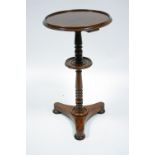 An early Victorian mahogany circular occasional table on turned centre column with central