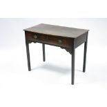 A late 18th century oak side table fitted frieze drawer with oval brass handles, & on square legs;
