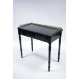 A 19th century French ebonised side table with pierced brass gallery, fitted three frieze drawers