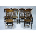 A set of six late 19th century ash & elm dining chairs with ball finials to the spindle backs,