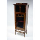 A late 19th/early 20th century continental mahogany narrow upright display cabinet with gilt-metal