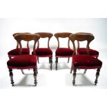 A set of six early Victorian mahogany dining chairs with shaped broad bow backs, padded seats, &