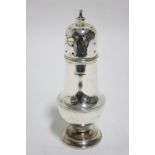 A baluster-shaped sugar castor on pedestal foot, 7" high.Birmingham 1924, by A & J Zimmerman. (