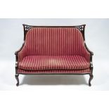 A late 19th century show-wood frame small sofa with padded back & seat, on slender cabriole legs;