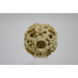 A Chinese carved ivory nest of concentric balls; 2¼” diam.