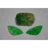 A Chinese green & mutton-fat jade carving of a fish amongst lily pads, 1½” high; & a pair of semi-