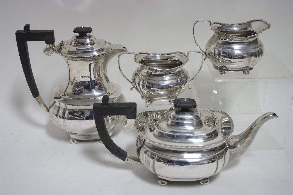 A regency-style four piece tea & coffee service of compressed oblong form, each with narrow