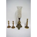 An early 19th century ormolu candle stand on triform base with lion-paw feet, & with tall etched