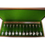 A set of twelve Royal Horticultural Society spoons, each with silver-gilt oval terminal depicting