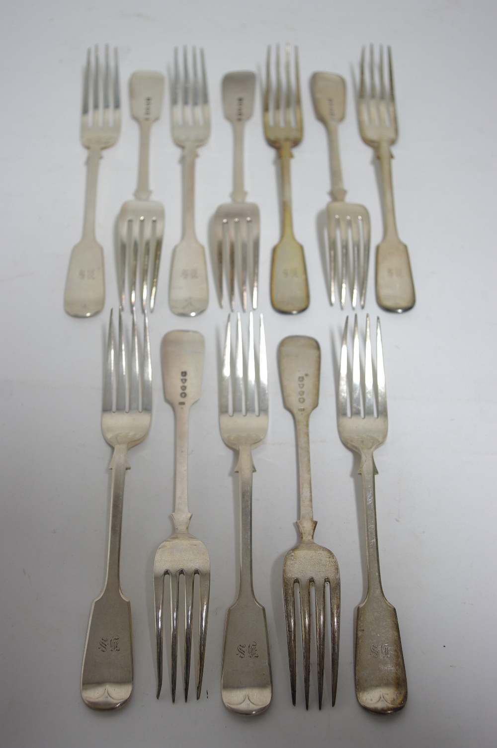 Twelve Victorian Fiddle pattern table forks, London 1877, by Goldsmiths’ Alliance (Samuel Smily). (